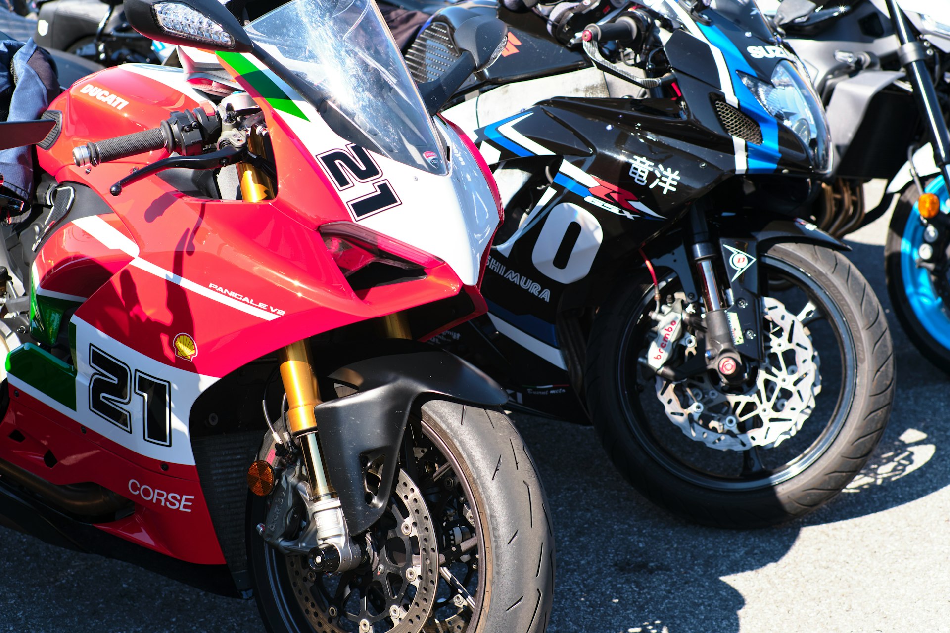 Two racing motorcycles parked side by side